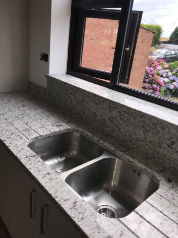 Granite worktops with polished sink cutout and double drainage channels