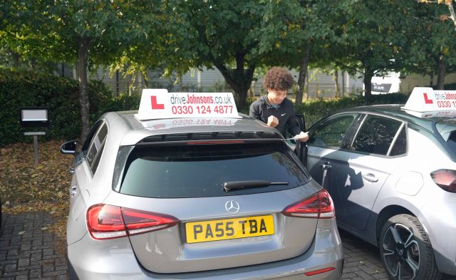 Happy pupil who has just passed with driveJohnson's