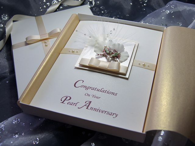 Kirika is a luxury handmade anniversary card which certainly is a natural beauty and is sure to please. This design uses cream and Ivory for a delicate look and elegant feel. The card is made from white sparkle board which has a lovely subtle shimmer. The