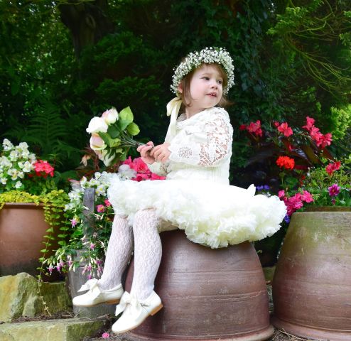 Little flower girl outdoor family portrait